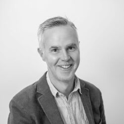 Black-and-white headshot of Joel Harrison, founder and editor-at-large, B2B marketing.