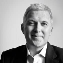 Black-and-white headshot of Brian Macreadie, Head of Marketing and all-round top bloke at Addleshaw Goddard LLP. 